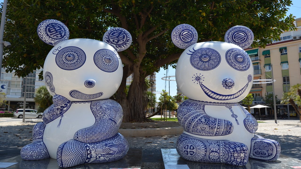 Sculptures of panda bears in the street