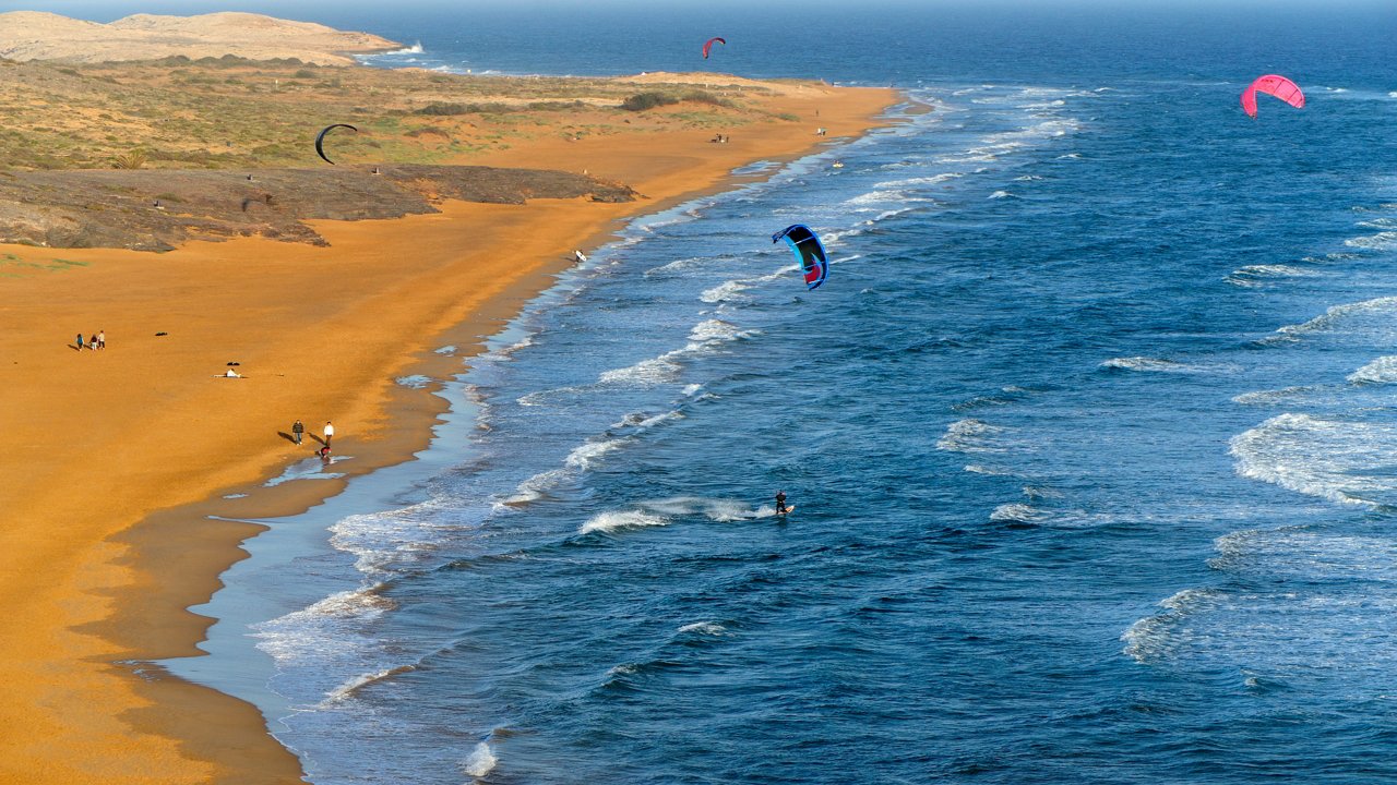 Surfers in Playa Larga de Calblanque